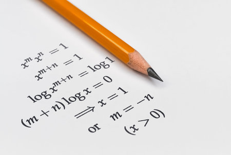 Services 131633632 math exercise and a yellow pencil on bright background